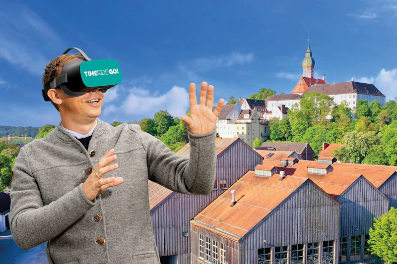 Gość z okularami VR przed klasztorem Andechs
